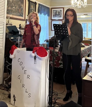 The Cover Girls performing holiday music at the 2022 UCHS party.