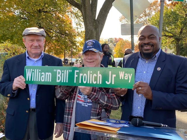 Officials unveil “William Bill Frolich Jr Way” street sign during the dedication event in Roselle on November 11, 2021.