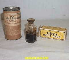 Vintage Hires Root Beer extract packaging, including a tin, glass bottle, and cardboard box.